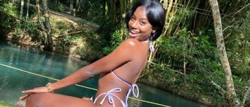 Abihail Myrie looking on with a smile during a river trip.