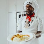 Popcaan cooking curry chicken and rice