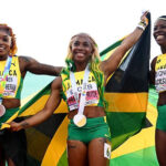 Shelly-Ann Fraser-Pryce, Shericka Jackson and Elaine Thompson-Herah celebrate after sweeping podium at the 2022 IAAF World Championships