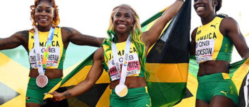 Shelly-Ann Fraser-Pryce, Shericka Jackson and Elaine Thompson-Herah celebrate after sweeping podium at the 2022 IAAF World Championships