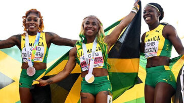 Shelly-Ann Fraser-Pryce, Shericka Jackson and Elaine Thompson-Herah celebrate after sweeping podium at the 2022 IAAF World Championships