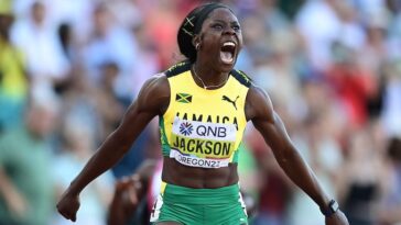 Shericka Jackson celebrates after winning the women's 200m at the 2022 IAAF World Championships