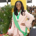 Shelly-Ann Fraser-Pryce shows her Order of Jamaica medal at the 2022 National Awards