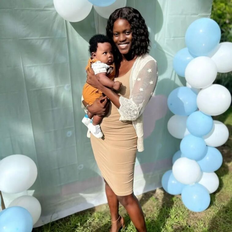 Konya Plummer poses with hew newborn son at a party