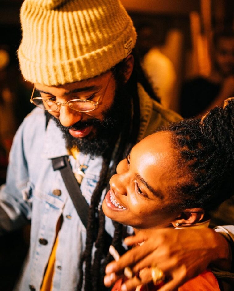 Grammy nominees Protoje and Koffee hang out at a party.