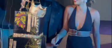 Asafa Powell cuts his 40th birthday cake alongside his wife, Alyshia Miller Powell