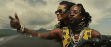 Popcaan and Toni-Ann Singh ride a motorcycle in their music video for 'Next to Me'