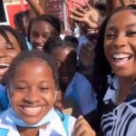 Shelly-Ann Fraser-Pryce interacts with students from her old school, Penwood Early Childhoo Institution