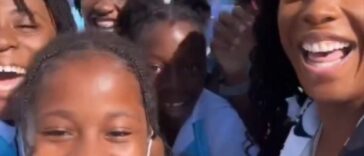 Shelly-Ann Fraser-Pryce interacts with students from her old school, Penwood Early Childhoo Institution