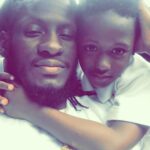 Aidonia hugging his late son, King Khalif Lawrence