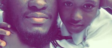 Aidonia hugging his late son, King Khalif Lawrence