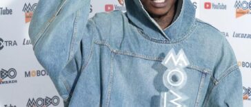 Skillibeng holds his MOBO Award on the red carpet of the 2022 MOBO Awards at the O2 Arena in London.