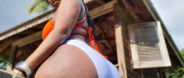 ZJ MoniQ teases with her curves as she sits on the edge of a pool