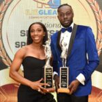 Shelly-Ann Fraser-Pryce and Rasheed Broadbell hold their awards at the 2022 RJR/Gleaner Sportsman and Sportswoman of the Year Award
