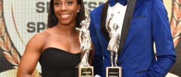 Shelly-Ann Fraser-Pryce and Rasheed Broadbell hold their awards at the 2022 RJR/Gleaner Sportsman and Sportswoman of the Year Award