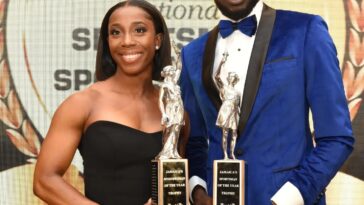 Shelly-Ann Fraser-Pryce and Rasheed Broadbell hold their awards at the 2022 RJR/Gleaner Sportsman and Sportswoman of the Year Award