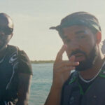 Popcaan and Drake hang out on a boat while shooting the music video for 'We Caa Done'