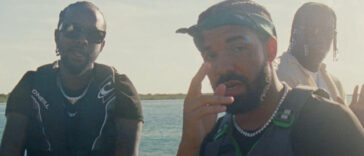 Popcaan and Drake hang out on a boat while shooting the music video for 'We Caa Done'
