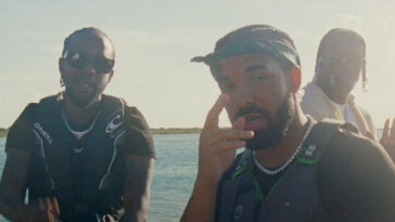 Popcaan and Drake hang out on a boat while shooting the music video for 'We Caa Done'