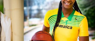Former WNBA player Simone Edwards holds a basketball as coach of Jamaica's national basketball team.