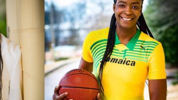 Former WNBA player Simone Edwards holds a basketball as coach of Jamaica's national basketball team.