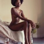 Davina Bennett poses on a bed for a Valentine's Day photoshoot