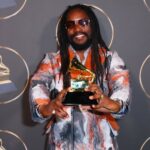 Kabaka Pyramid holds his Reggae Grammy award on the red carper at the 65th Grammy Awards in Los Angeles.