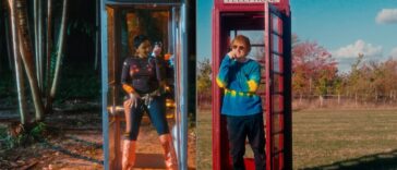 Ishawna and Ed Sheeran talk in phone booths during the official music video for 'Brace It'
