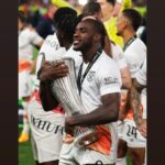 Michail Antonio holds the Europa Conference League title during celebration in Prague