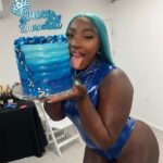 Spice holds her birthday cake after her show in Sint Maarten