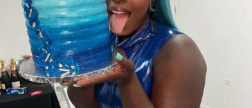 Spice holds her birthday cake after her show in Sint Maarten