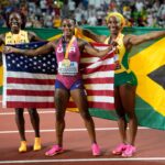 Sha'Carri Richardson, Shelly-Ann Fraser-Pryce and Shericka Jackson celebrate after the 100m final at the 2023 IAAF World Championships in Athletics