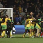 Reggae Girlz players celebrate wildly after holding Brazil to earn last 16 berth at the 2023 Women's World Cup.