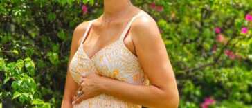 Yendi Phillipps holds her belly as she celebrates her latest pregnancy.