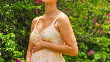 Yendi Phillipps holds her belly as she celebrates her latest pregnancy.