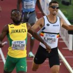 Christopher Taylor crosses the finish line in the men's 4x400 m relay final at the 2022 IAAF World Championships