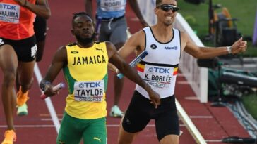 Christopher Taylor crosses the finish line in the men's 4x400 m relay final at the 2022 IAAF World Championships