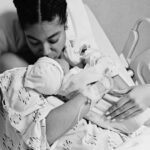Yendi Phillipps holds her son, Isaiah, in the hospital after giving birth.