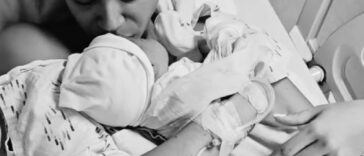 Yendi Phillipps holds her son, Isaiah, in the hospital after giving birth.