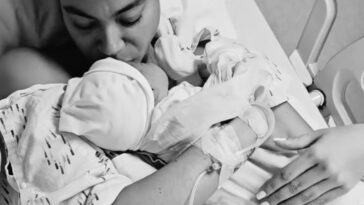 Yendi Phillipps holds her son, Isaiah, in the hospital after giving birth.