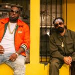 Killer Mike and Damian Marley sit outside during music video for "Run."