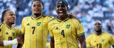 A'Mari Bell celebrates with his teammates after scoring for Jamaica in the 2023 Gold Cup against Guatemala.