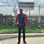 Popcaan stands in front of the St Thomas Parish Court following a court hearing on Jan. 10, 2024.