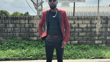 Popcaan stands in front of the St Thomas Parish Court following a court hearing on Jan. 10, 2024.