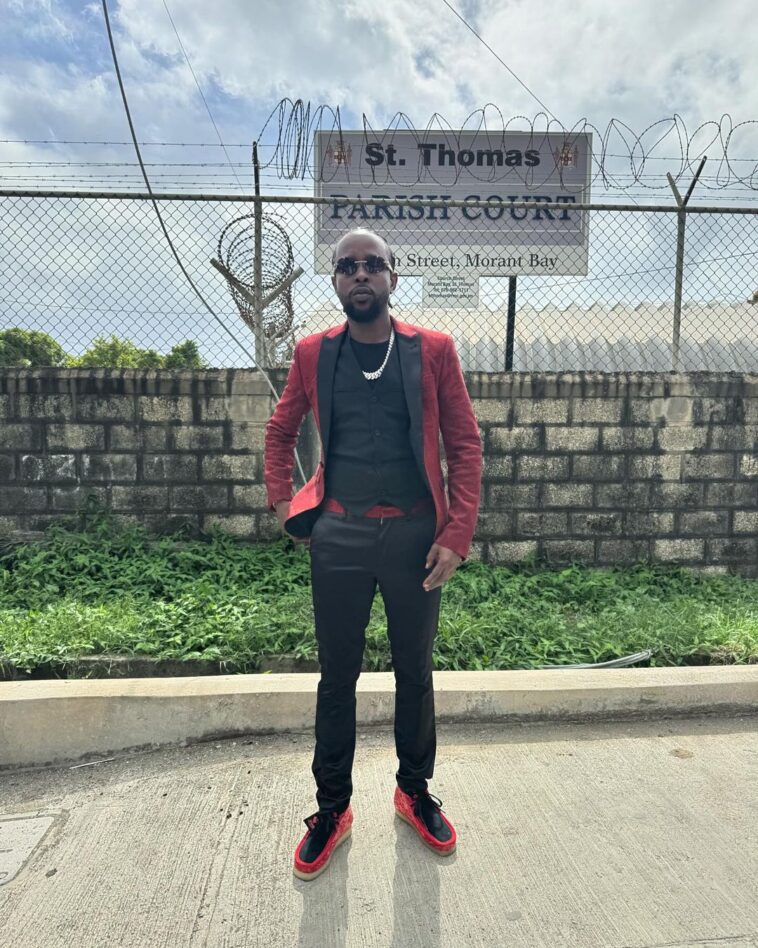 Popcaan stands in front of the St Thomas Parish Court following a court hearing on Jan. 10, 2024.