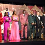 Shericka Jackson (far left) and Antonio Watson (middle) hold their respective RJR/Gleaner Sportswoman and Sportsman of the Year trophies.