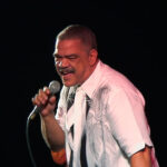 The late Pluto Shervington singing at an event.