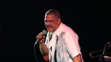 The late Pluto Shervington singing at an event.