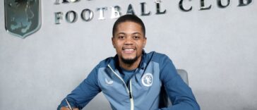Leon Bailey signs his new contract for Aston Villa.