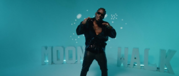 Aidonia performs in his music video for "Moonwalk."